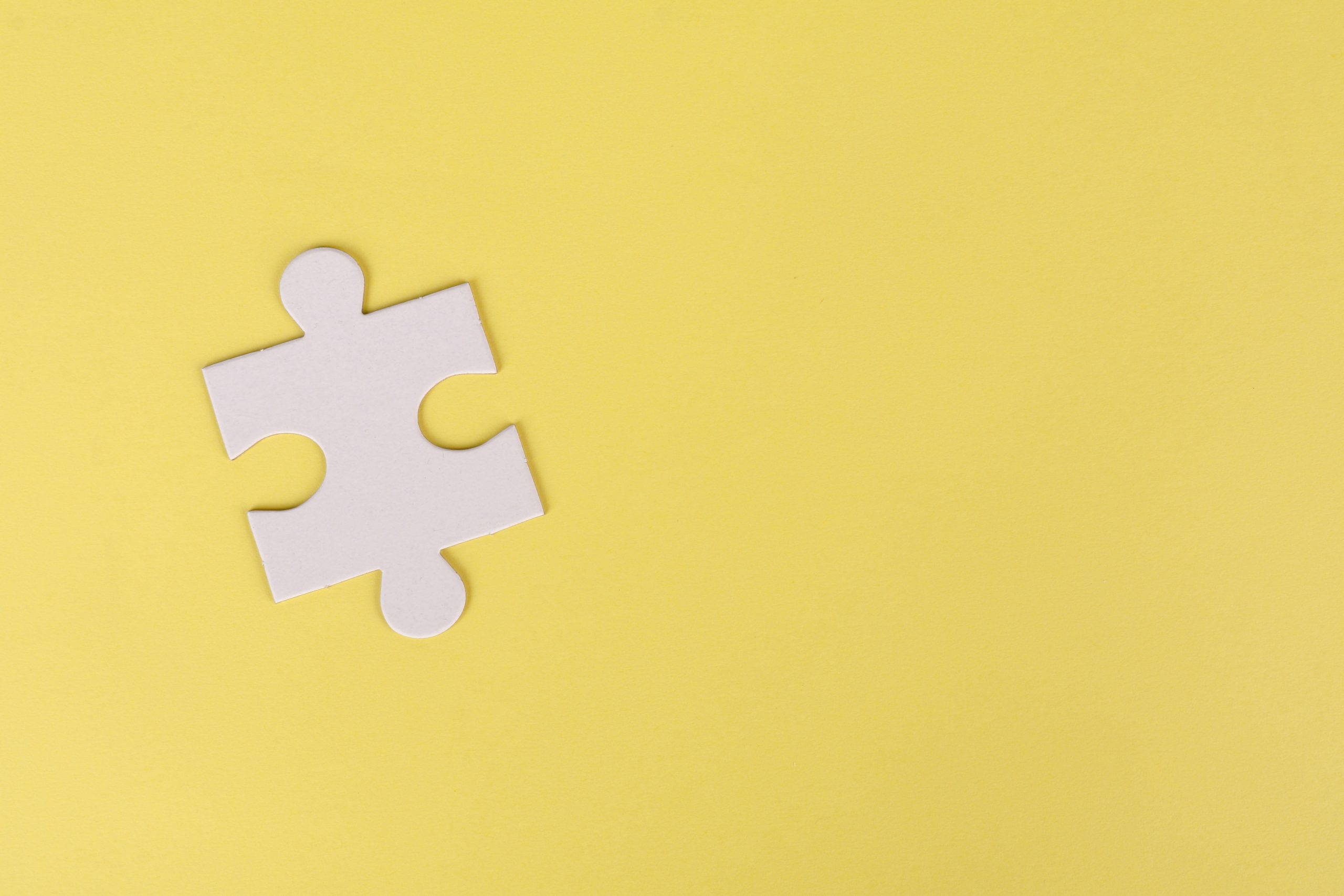 Jigsaw Puzzle on Yellow Background